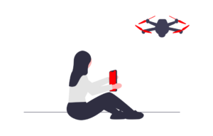 grafika kobiety z czerwonym tabletem w dłoniach sterującej dronem